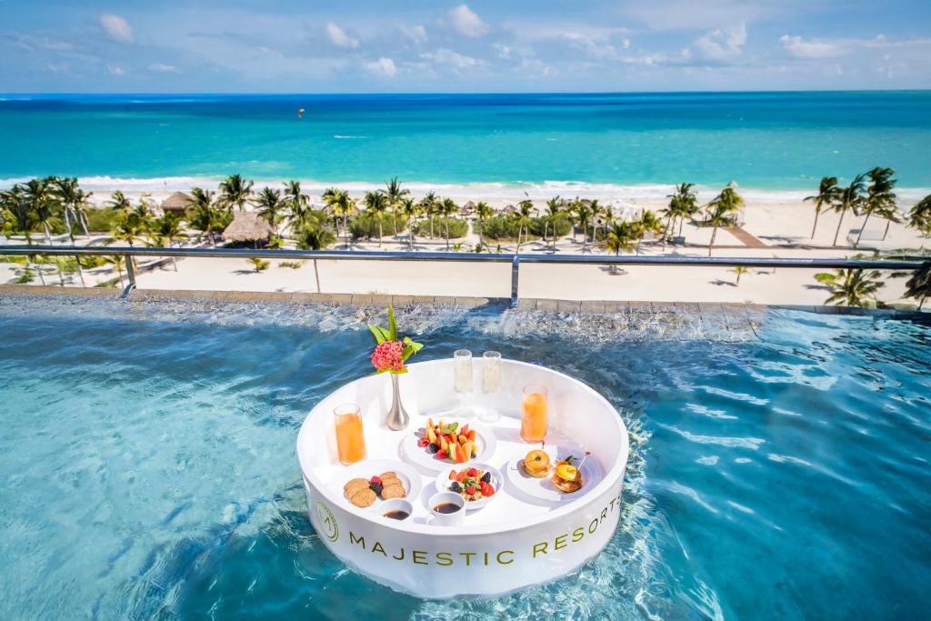 Majestic Elegance Costa Mujeres floating breakfast in the Oceanfront Suite with private Pool